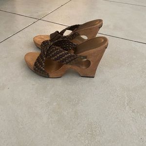 Michael Kors wooden braided mules with braided leather upper.